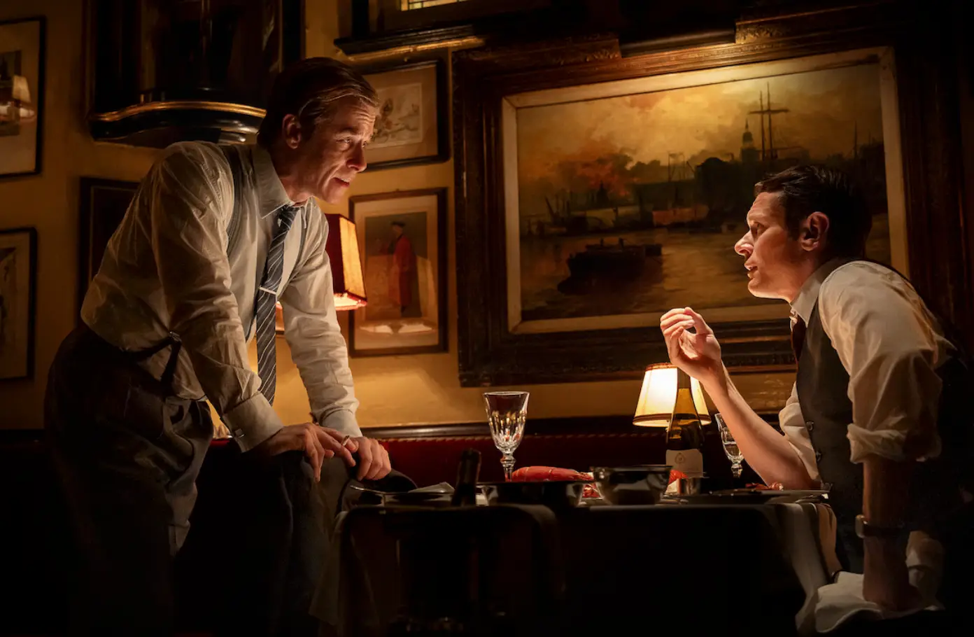 Two men in a wood-paneled study in a still from Danny Boyle's 'Ink'